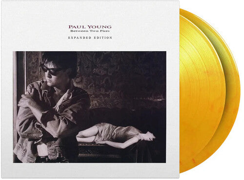 Paul Young - Between Two Fires - Limited & Expanded 180-Gram Flame Colored Vinyl (Vinyl) { vinyl }